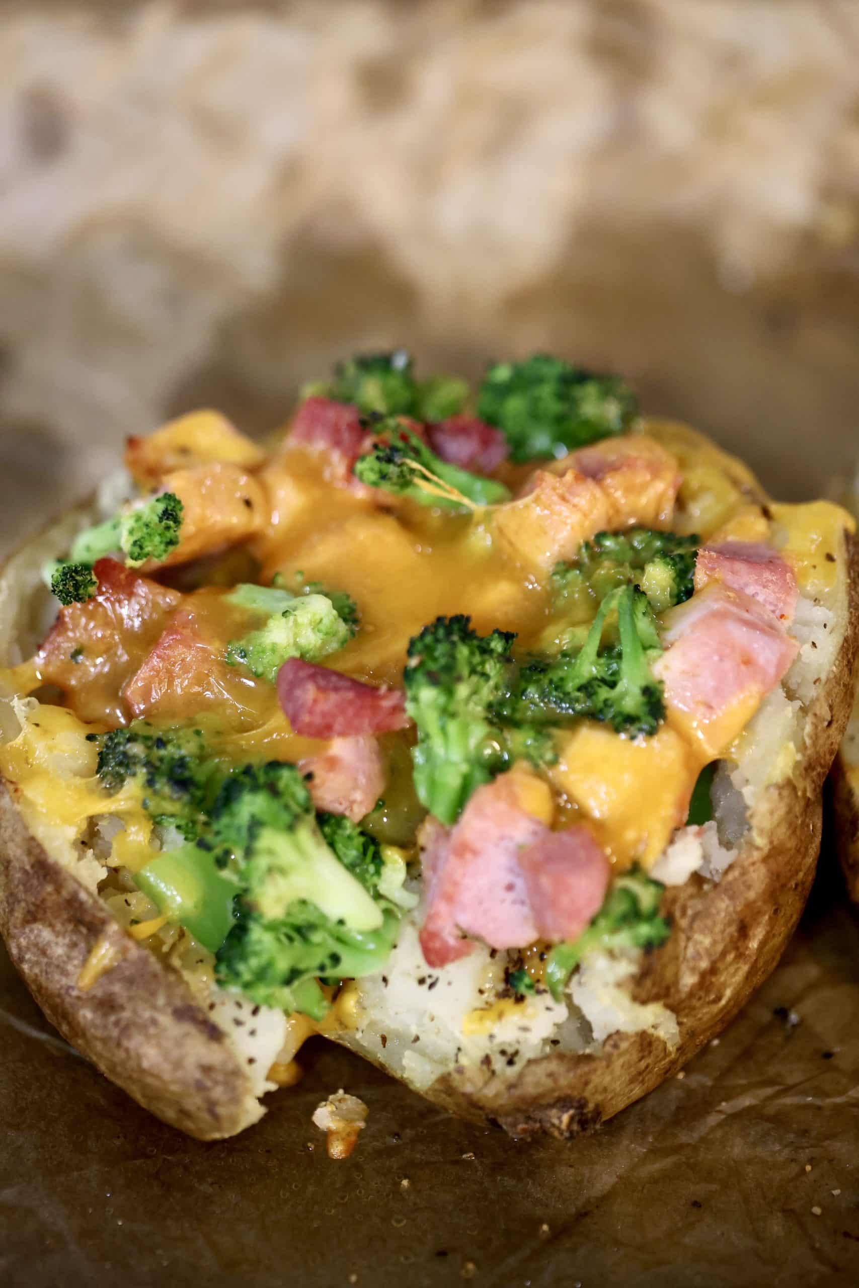 Loaded baked potato with leftover ham. Ham, cheese and broccoli stuffed baked potato.