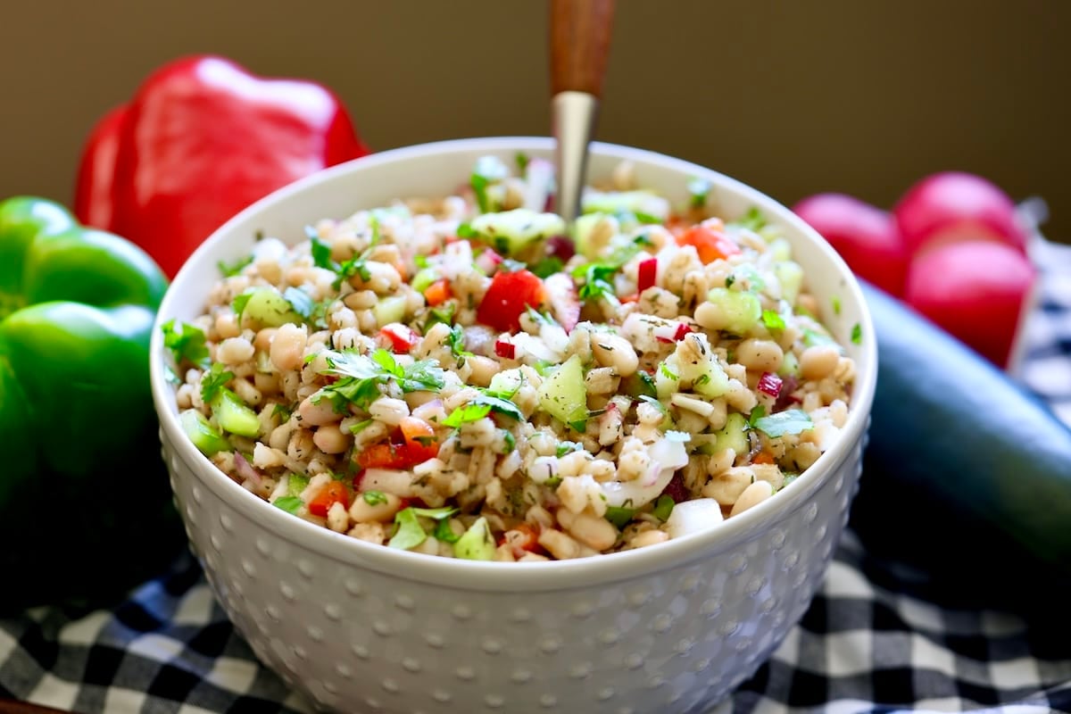 Bowl of white bean and barley salad.