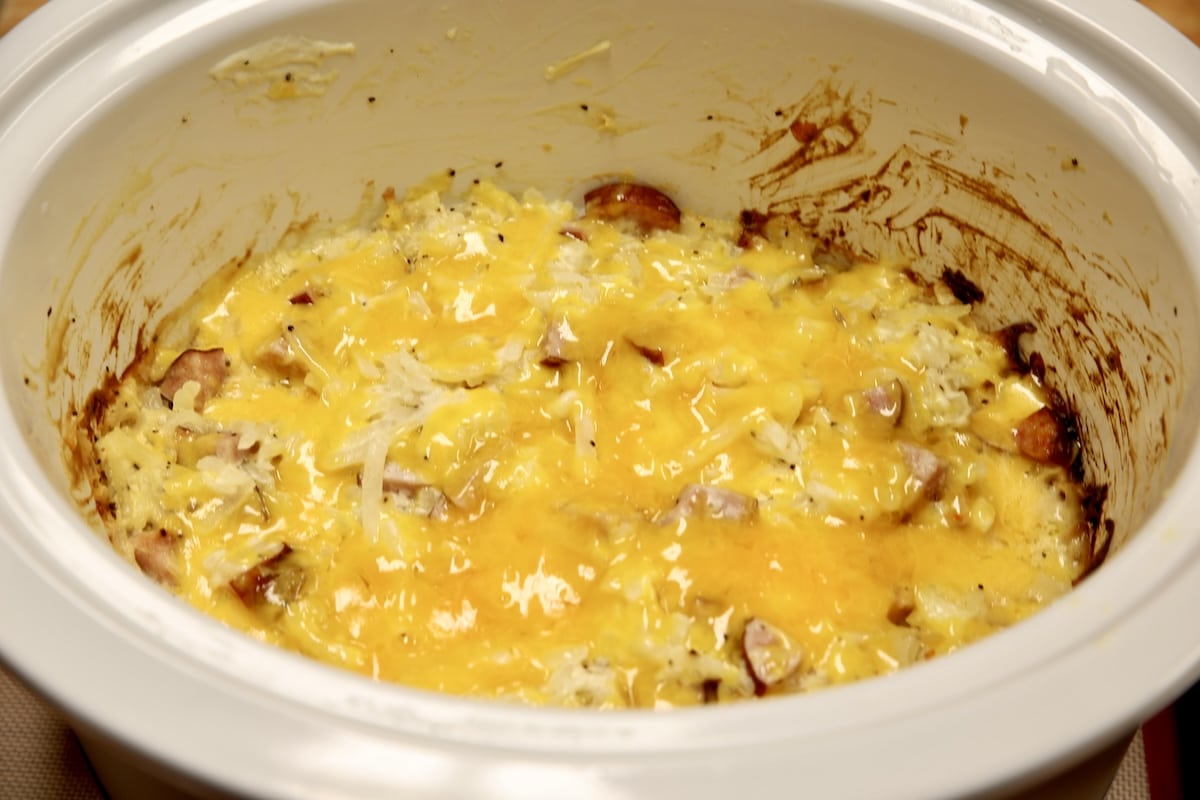 Cheesy smoked sausage hashbrown casserole in crock pot.