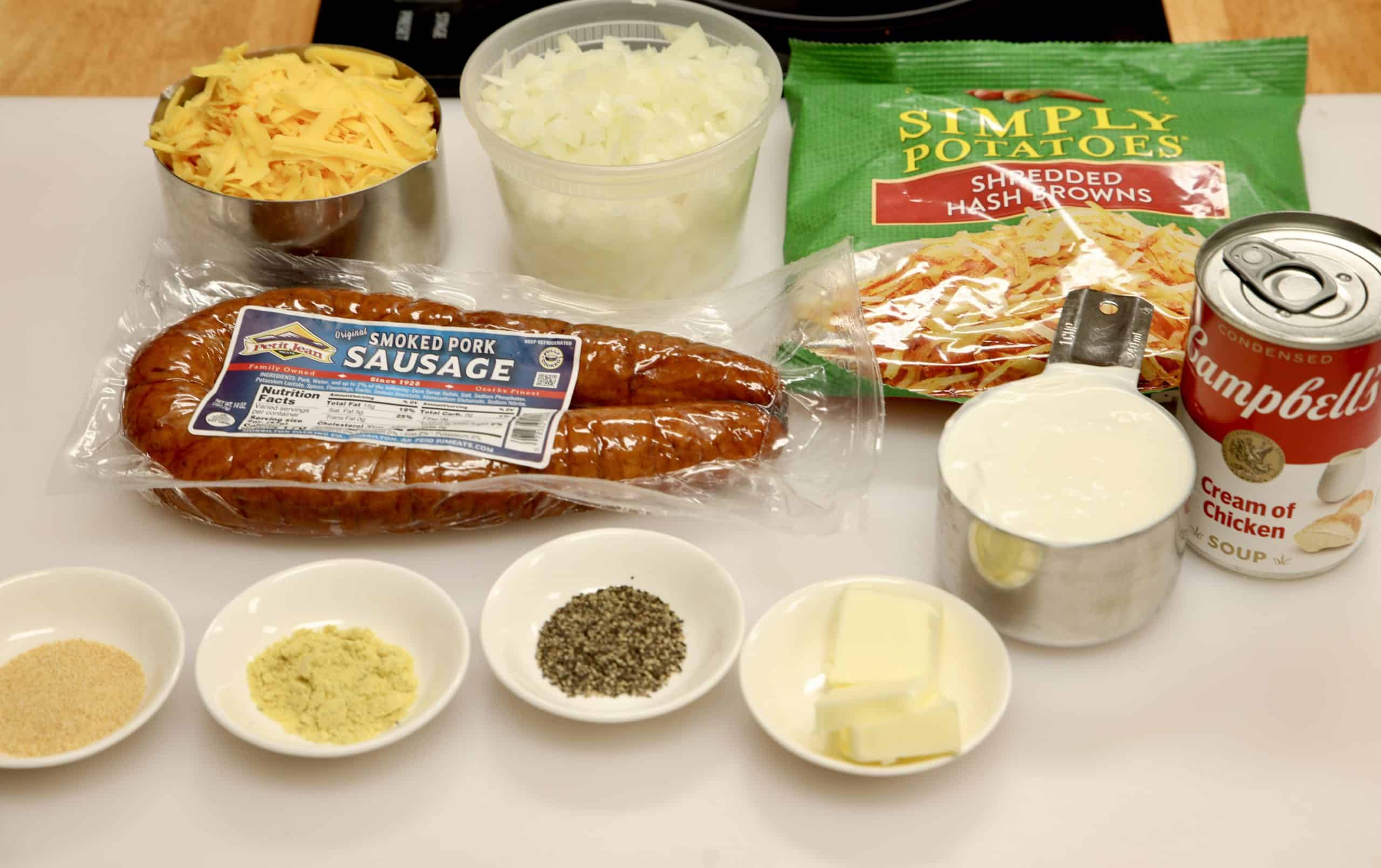 Ingredients for Crock pot hashbrown casserole with smoked sausage.