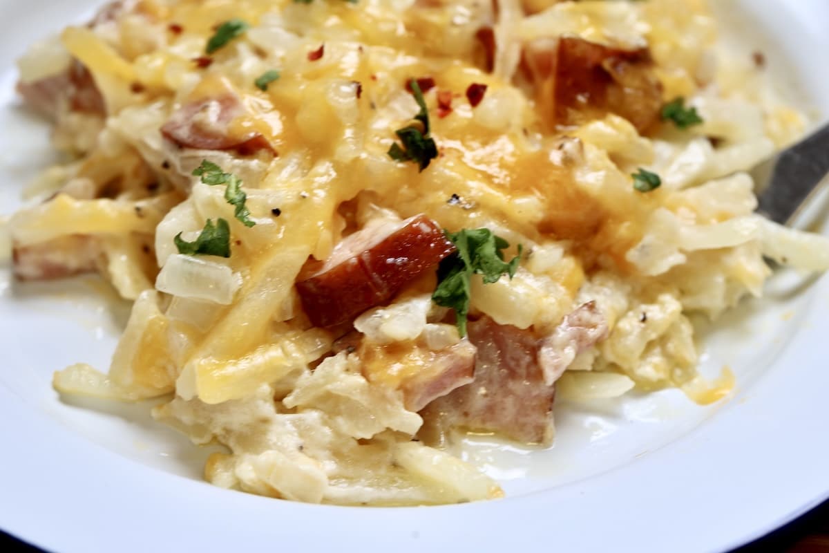 Smoked sausage hashbrown casserole on a plate.